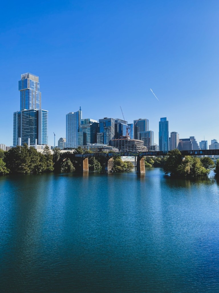city skyline under blue sky during daytime